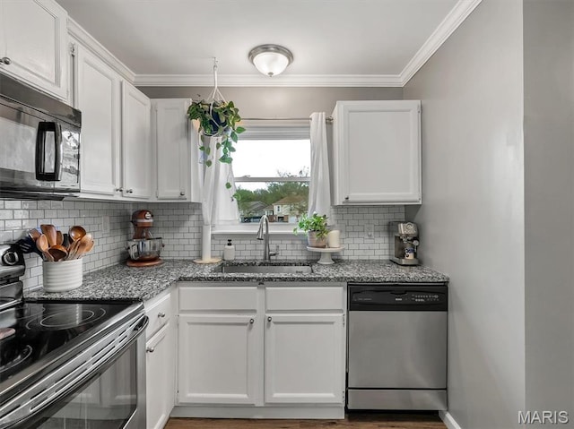 447 Omar Ct, Saint Peters, MO 63376 - kitchen with stainless steel dishwasher, electric range, black microwave, a sink, and white cabinetry