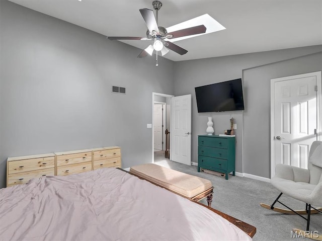 447 Omar Ct, Saint Peters, MO 63376 - carpeted bedroom with vaulted ceiling, baseboards, a skylight, and a ceiling fan
