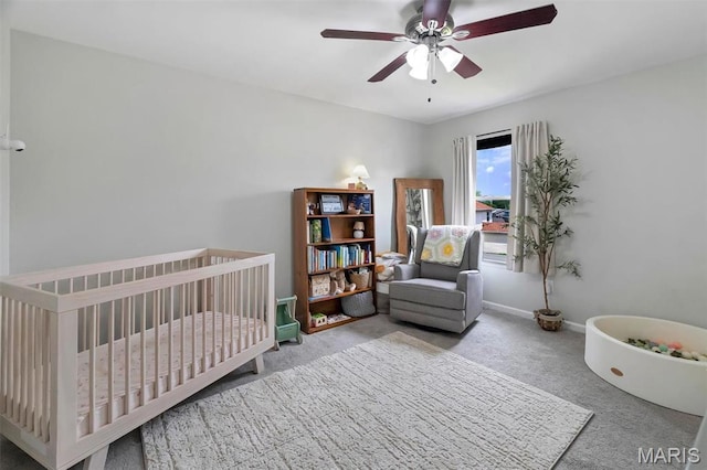 447 Omar Ct, Saint Peters, MO 63376 - carpeted bedroom with a nursery area, ceiling fan, and baseboards