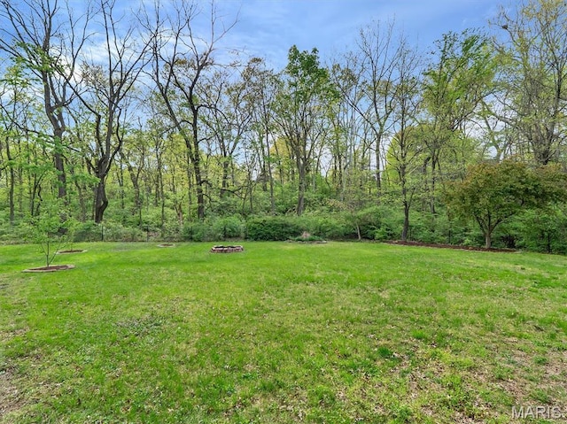 447 Omar Ct, Saint Peters, MO 63376 - view of green lawn featuring an outdoor fire pit