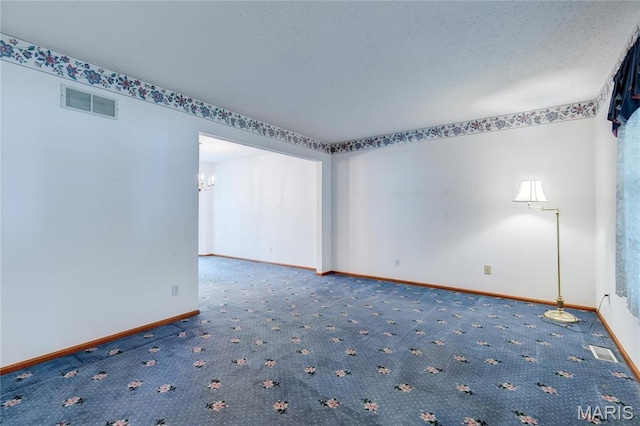 1101 Nathaniel Ct, Hazelwood, MO 63042 - carpeted empty room featuring baseboards and a chandelier