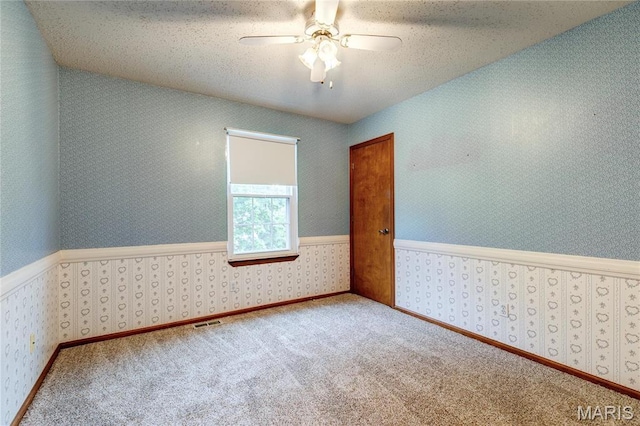1101 Nathaniel Ct, Hazelwood, MO 63042 - unfurnished room with a ceiling fan, wallpapered walls, and carpet floors