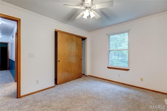 1101 Nathaniel Ct, Hazelwood, MO 63042 - unfurnished bedroom with carpet, ornamental molding, baseboards, a closet, and a textured ceiling