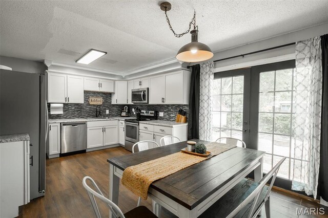 2003 Kysar Rd, Poplar Bluff, MO 63901 - kitchen featuring stainless steel appliances, a sink, french doors, a textured ceiling, and light countertops