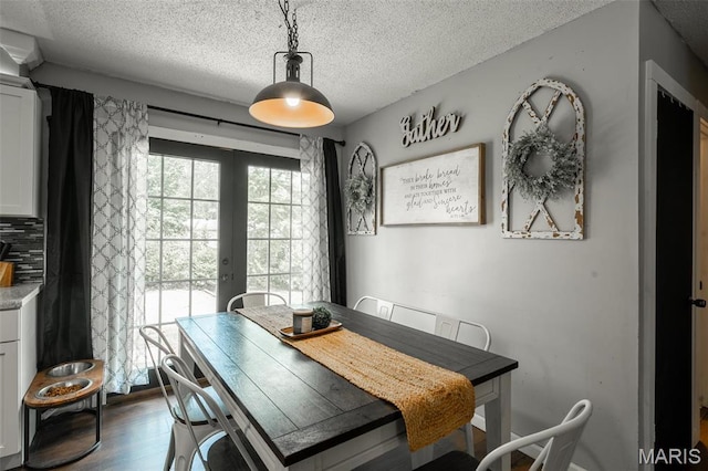 2003 Kysar Rd, Poplar Bluff, MO 63901 - dining room featuring french doors, a textured ceiling, and dark wood-style floors