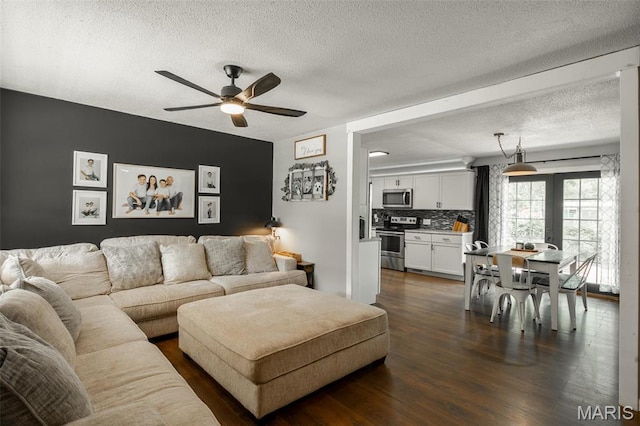 2003 Kysar Rd, Poplar Bluff, MO 63901 - living room featuring a ceiling fan, a textured ceiling, and dark wood-type flooring