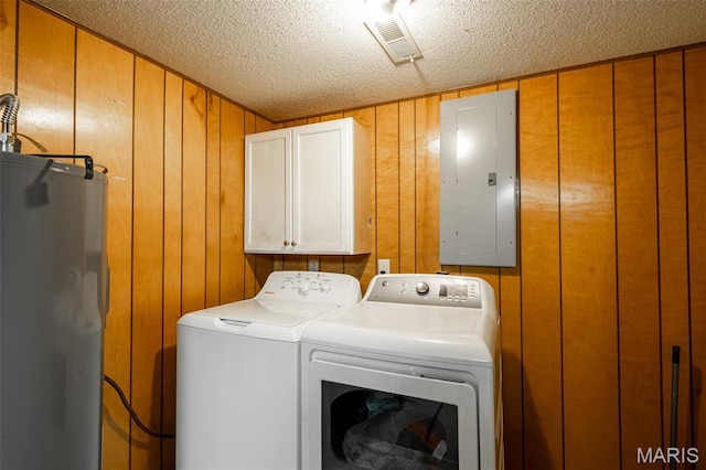 2003 Kysar Rd, Poplar Bluff, MO 63901 - clothes washing area featuring electric panel, cabinet space, electric water heater, separate washer and dryer, and a textured ceiling