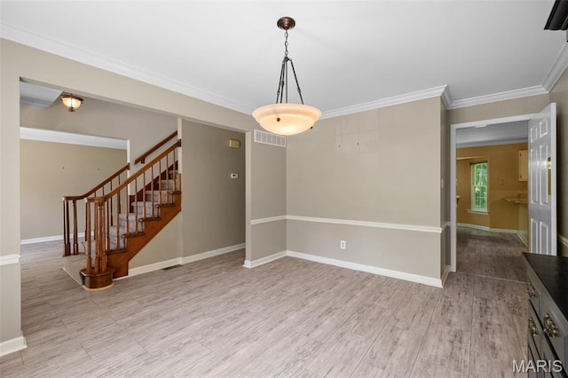 1439 Briarcreek Dr, Saint Louis, MO 63122 - empty room with wood finished floors, stairs, and ornamental molding