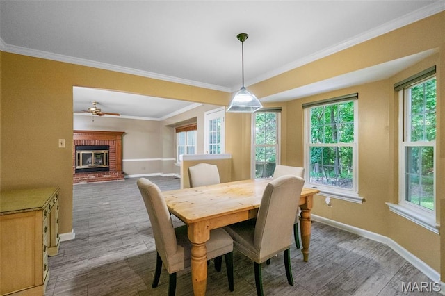 1439 Briarcreek Dr, Saint Louis, MO 63122 - dining area with wood finished floors, ornamental molding, plenty of natural light, and a brick fireplace