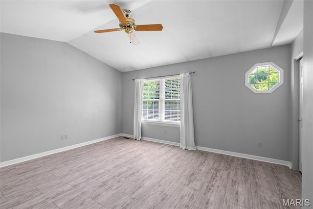 1439 Briarcreek Dr, Saint Louis, MO 63122 - empty room with plenty of natural light, a ceiling fan, wood finished floors, and vaulted ceiling