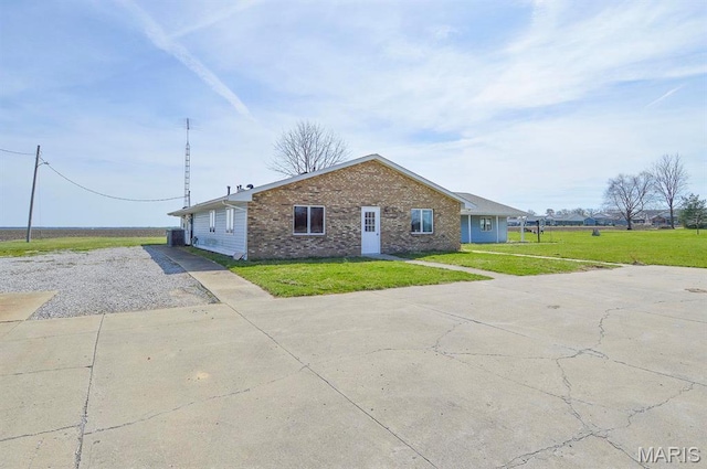620 N Main St, Hoyleton, IL 62803 - view of front of property featuring driveway, brick siding, and a front lawn