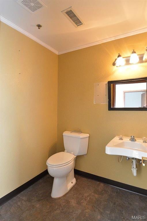 620 N Main St, Hoyleton, IL 62803 - bathroom with ornamental molding, toilet, a sink, and baseboards
