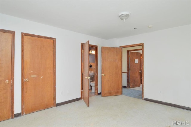 620 N Main St, Hoyleton, IL 62803 - unfurnished bedroom with two closets, baseboards, and ensuite bathroom