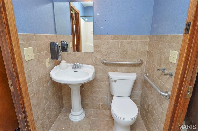 620 N Main St, Hoyleton, IL 62803 - bathroom with toilet, tile walls, tile patterned flooring, and a wainscoted wall