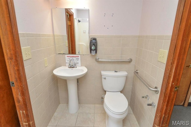 620 N Main St, Hoyleton, IL 62803 - half bathroom with tile walls, toilet, and a wainscoted wall