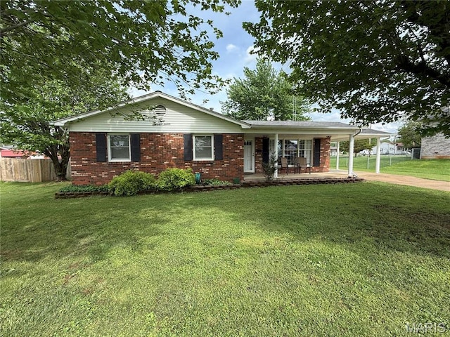 217 Williams St, Fredericktown, MO 63645 - single story home with a porch, brick siding, driveway, and an attached carport