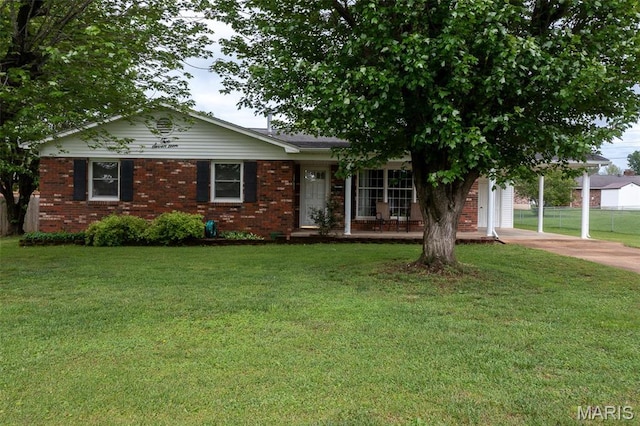 217 Williams St, Fredericktown, MO 63645 - view of front of house featuring concrete driveway, brick siding, and covered porch