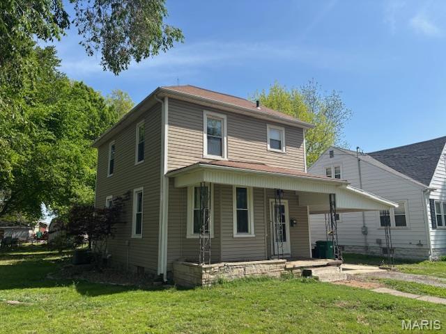 421 S 3rd St, Breese, IL 62230 - view of front facade with covered porch and a front lawn