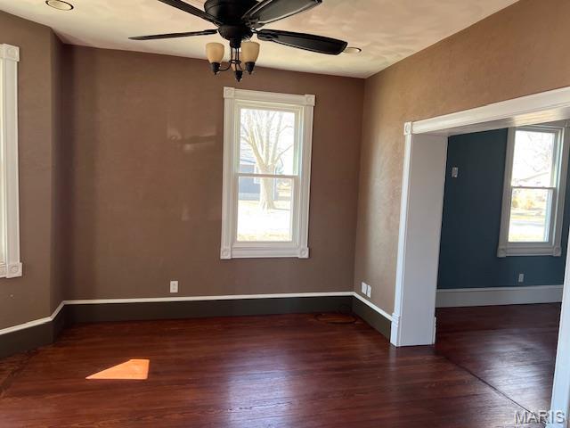 421 S 3rd St, Breese, IL 62230 - empty room featuring wood finished floors, a ceiling fan, and baseboards