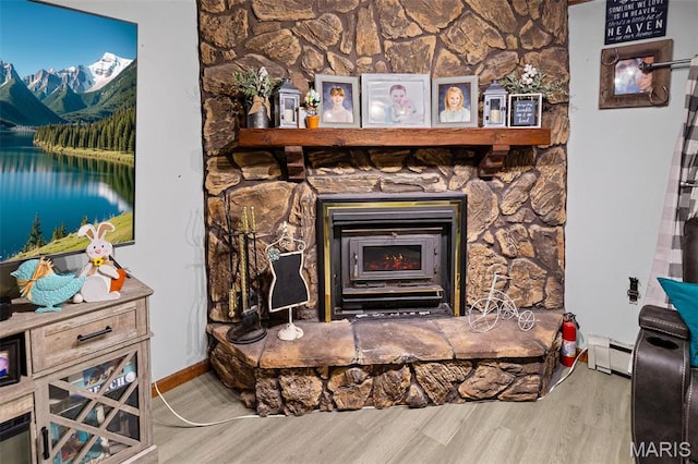 519 N Maple St, Duquoin, IL 62832 - detailed view of wood finished floors, baseboard heating, and a fire extinguisher