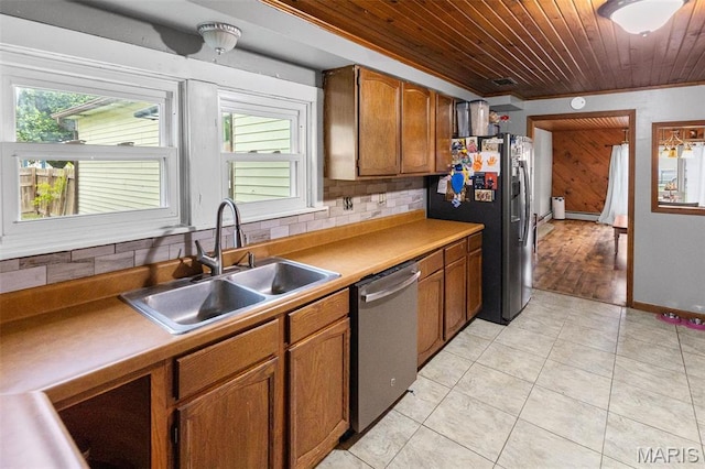 519 N Maple St, Duquoin, IL 62832 - kitchen featuring appliances with stainless steel finishes, a sink, wooden ceiling, brown cabinetry, and light tile patterned flooring