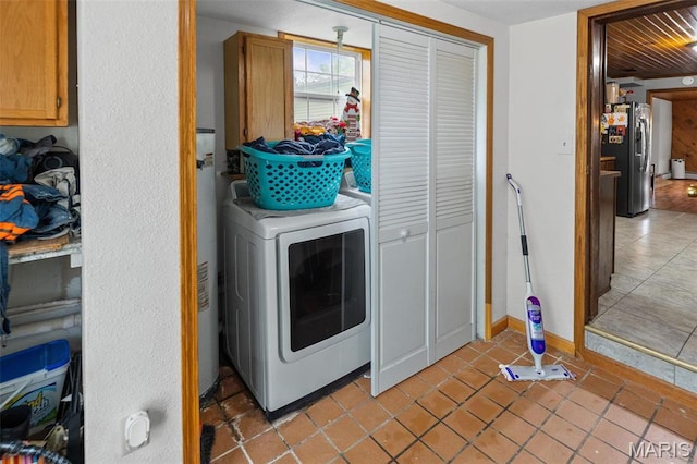 519 N Maple St, Duquoin, IL 62832 - clothes washing area with washer / clothes dryer, light tile patterned floors, and baseboards