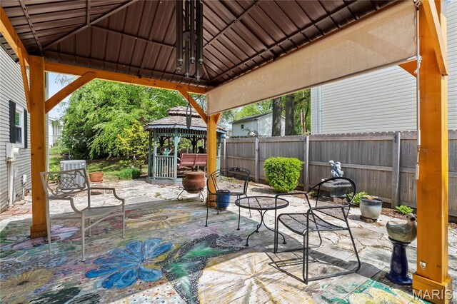 view of patio / terrace with a gazebo and a fenced backyard