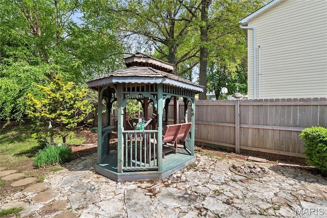 view of patio / terrace featuring fence and a gazebo