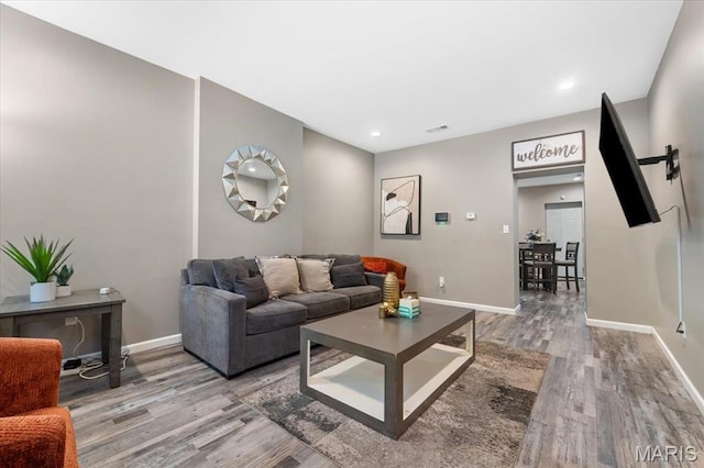 1428 Mallinckrodt, Saint Louis, MO 63107 - living room featuring wood finished floors, baseboards, and recessed lighting