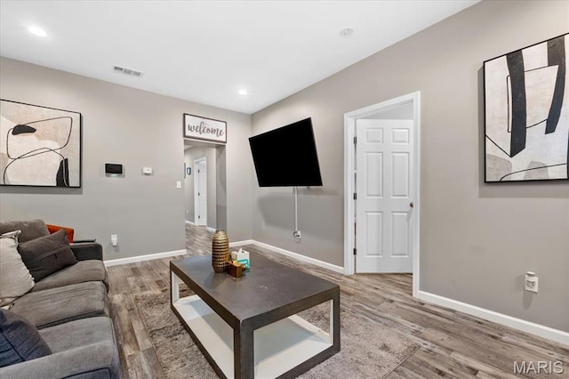 1428 Mallinckrodt, Saint Louis, MO 63107 - living area with wood finished floors, baseboards, and recessed lighting