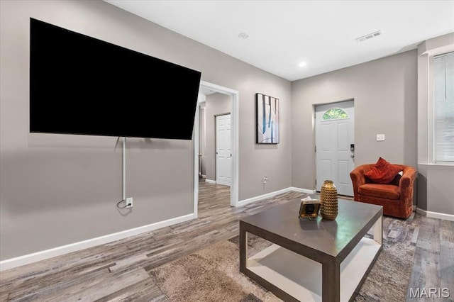 1428 Mallinckrodt, Saint Louis, MO 63107 - living area featuring wood finished floors, baseboards, and recessed lighting