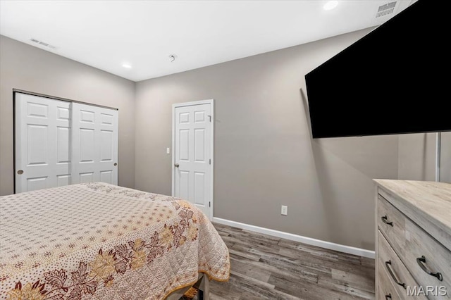 1428 Mallinckrodt, Saint Louis, MO 63107 - bedroom featuring wood finished floors, baseboards, recessed lighting, and a closet