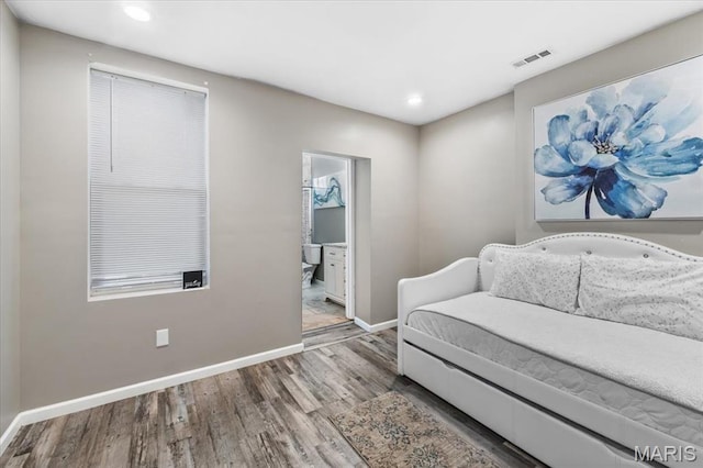 1428 Mallinckrodt, Saint Louis, MO 63107 - sitting room featuring wood finished floors, baseboards, and recessed lighting