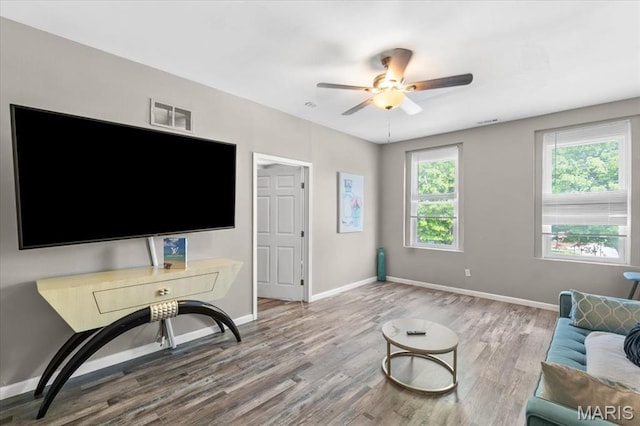 1428 Mallinckrodt, Saint Louis, MO 63107 - living area with wood finished floors, a ceiling fan, and baseboards