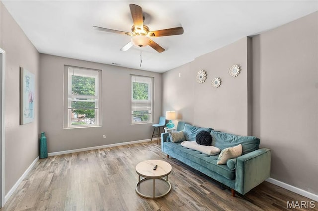 1428 Mallinckrodt, Saint Louis, MO 63107 - living area with wood finished floors, a ceiling fan, and baseboards