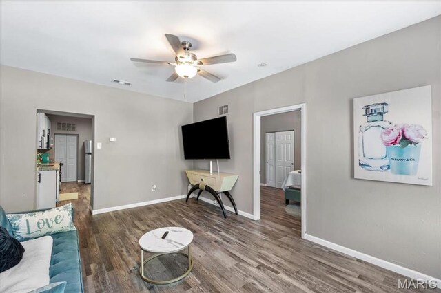 1428 Mallinckrodt, Saint Louis, MO 63107 - living area with ceiling fan, wood finished floors, and baseboards