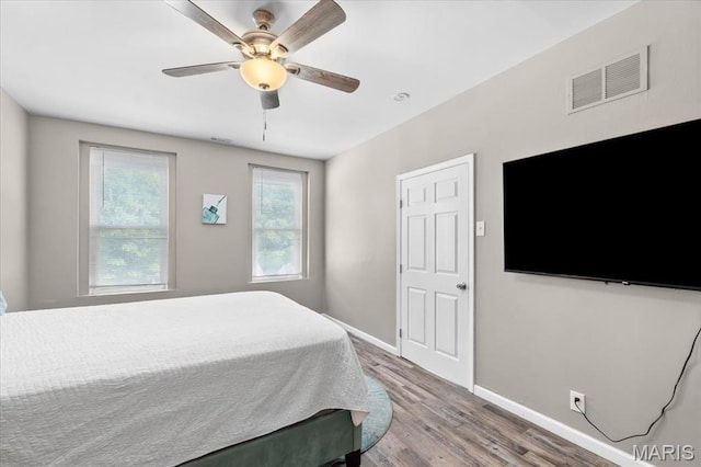 1428 Mallinckrodt, Saint Louis, MO 63107 - bedroom featuring wood finished floors, baseboards, and a ceiling fan