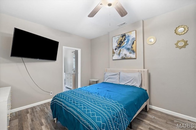 1428 Mallinckrodt, Saint Louis, MO 63107 - bedroom with wood finished floors, baseboards, a ceiling fan, and ensuite bath