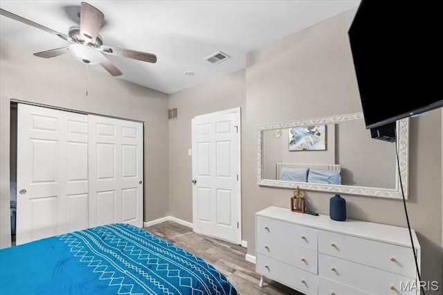 1428 Mallinckrodt, Saint Louis, MO 63107 - bedroom featuring wood finished floors, a closet, baseboards, and ceiling fan
