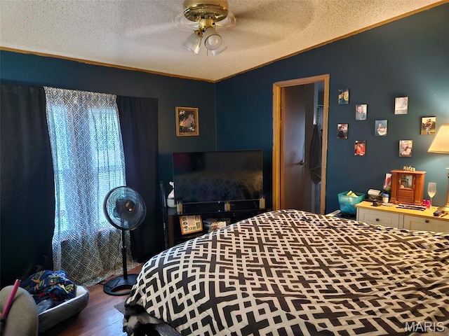 211 N Lucas St, Pilot Knob, MO 63663 - bedroom featuring a textured ceiling, wood finished floors, ornamental molding, lofted ceiling, and a ceiling fan