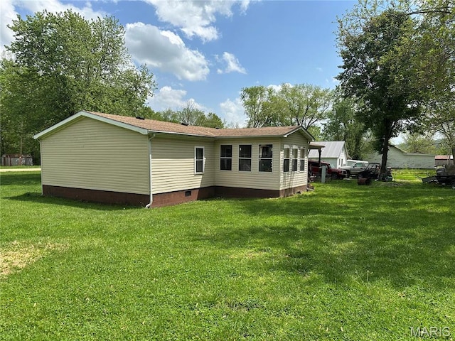 211 N Lucas St, Pilot Knob, MO 63663 - back of property featuring crawl space and a lawn