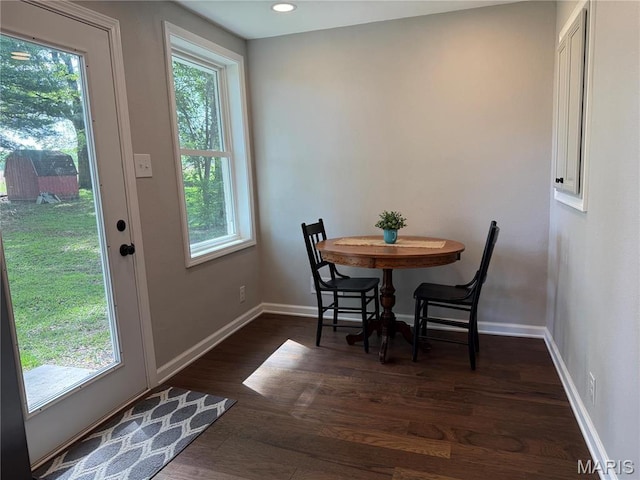 409 Oak St, East Alton, IL 62024 - dining space featuring plenty of natural light, baseboards, and dark wood-style floors