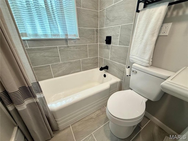 409 Oak St, East Alton, IL 62024 - bathroom featuring toilet and shower / tub combo