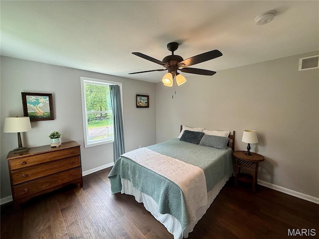 409 Oak St, East Alton, IL 62024 - bedroom with baseboards, wood finished floors, and a ceiling fan