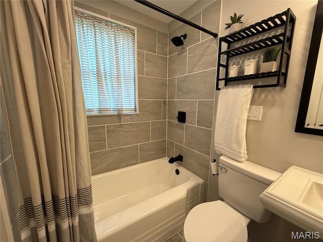 409 Oak St, East Alton, IL 62024 - bathroom featuring toilet, shower / tub combo, and a sink