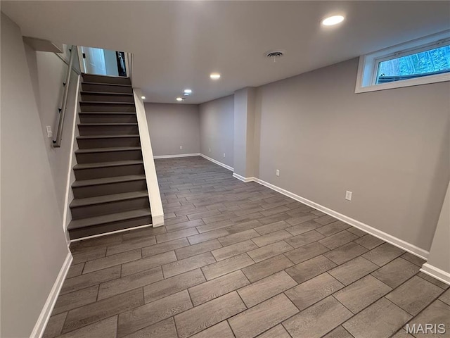 409 Oak St, East Alton, IL 62024 - below grade area with stairs, baseboards, dark wood finished floors, and recessed lighting