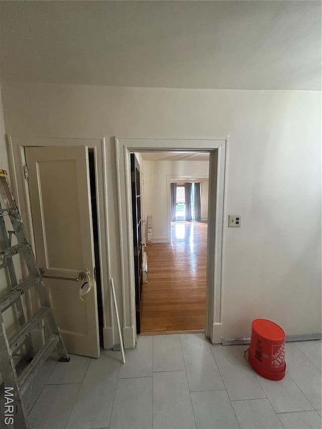 916 Eastgate Ave, Saint Louis, MO 63130 - corridor with baseboards and light tile patterned floors