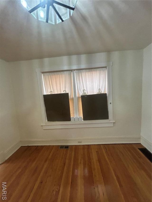 916 Eastgate Ave, Saint Louis, MO 63130 - empty room with baseboards and wood finished floors
