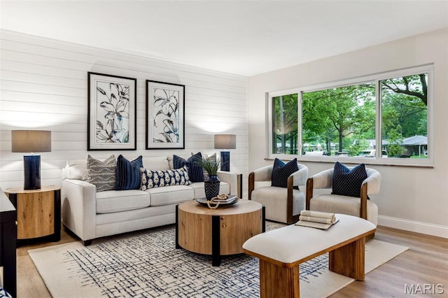 1548 Park Dr Way, Saint Louis, MO 63130 - living room with baseboards, light wood-style flooring, and wooden walls