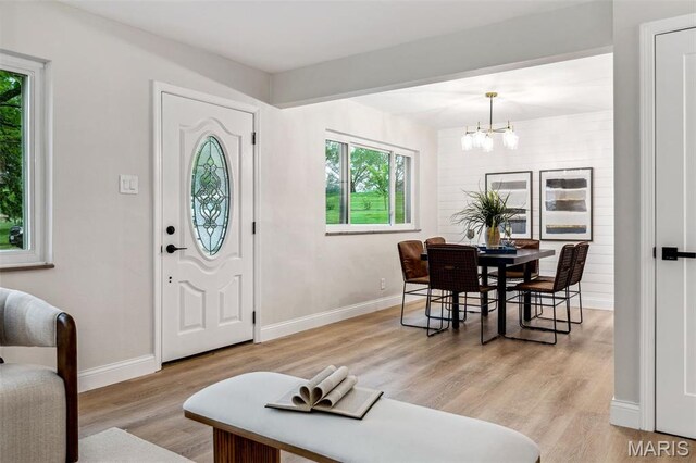 1548 Park Dr Way, Saint Louis, MO 63130 - entrance foyer featuring a chandelier, light wood-type flooring, and baseboards